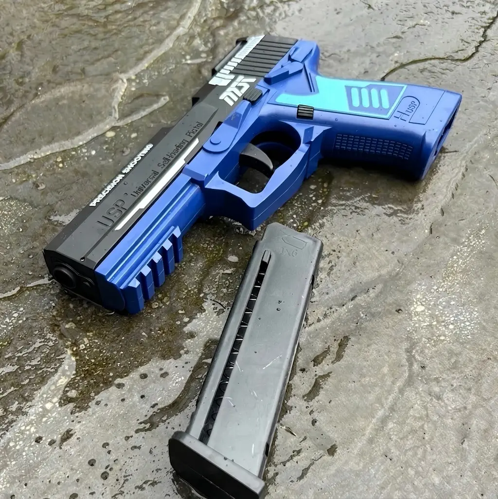 Slide locked back in empty chamber hold-open mode on the blue USP45 soft bullet toy gun